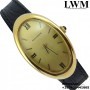 Anonimo MOVADO   Oval Museum Curvex yellow gold 18KT 1970